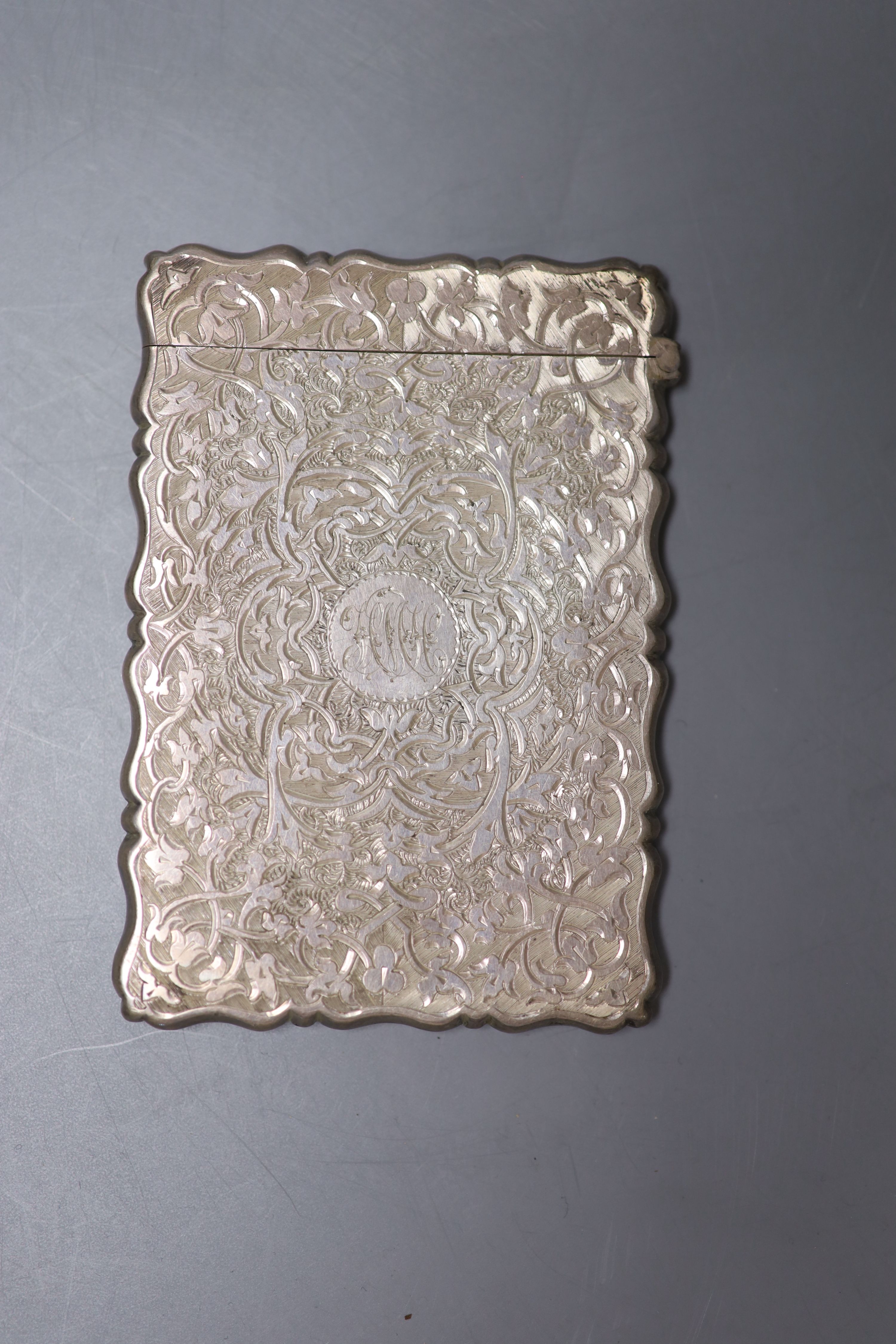 A cased Victorian engraved silver calling card case, George Unite, Birmingham 1878, 96mm.